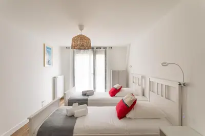 Un ou plusieurs lits dans un hébergement de l'établissement Le Cap Catamaran - Maison pour 6p à Cancale