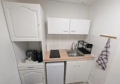 Cuisine ou kitchenette dans l'établissement Paisible - Proche Palais des Sports et Zénith