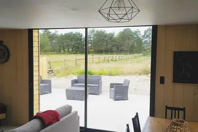Coin salon dans l'établissement Le gîte de la Ferme