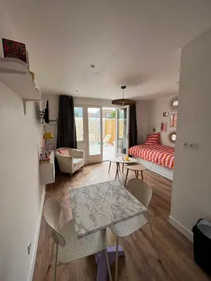 Coin salon dans l'établissement Appartements - Riva Bella