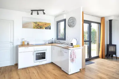 Cuisine ou kitchenette dans l'établissement L'Harmonie - A 5min de la plage