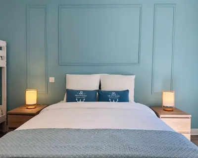 Un ou plusieurs lits dans un hébergement de l'établissement Appartement Au Cœur de Granville