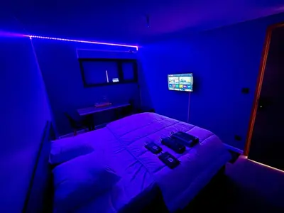 Télévision ou salle de divertissement dans l'établissement Chambre Rozanna