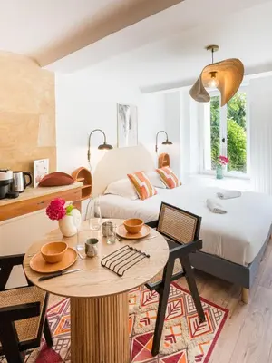 Un ou plusieurs lits dans un hébergement de l'établissement Villa Robs - Appartements tout confort, TV connectée, Haut débit, Localisation idéale - Courts séjours & Affaires