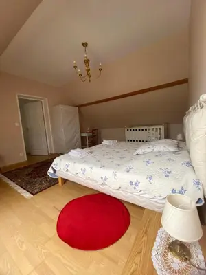 Un ou plusieurs lits dans un hébergement de l'établissement La Maison d'Aimé - Spacieuse et grand jardin