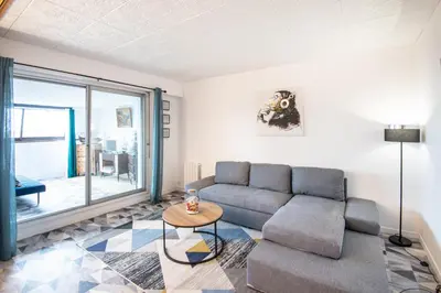 Coin salon dans l'établissement Titi - À Courseulles-sur-Mer, 7 min de la plage