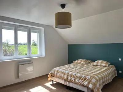 Un ou plusieurs lits dans un hébergement de l'établissement Maison proche plages du débarquement
