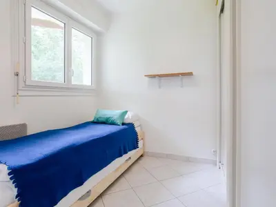 Un ou plusieurs lits dans un hébergement de l'établissement Apartment Plein Sud-17 by Interhome