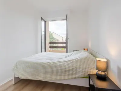Un ou plusieurs lits dans un hébergement de l'établissement Apartment Le Sporting-17 by Interhome