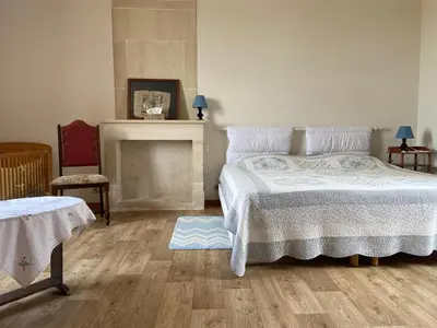 Un ou plusieurs lits dans un hébergement de l'établissement Le Camp Romain, maison familiale avec terrain