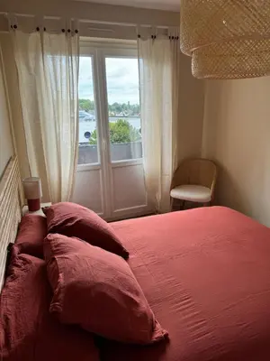 Un ou plusieurs lits dans un hébergement de l'établissement Appartement charmant