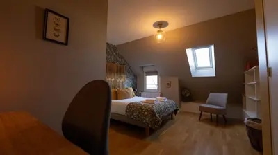 Un ou plusieurs lits dans un hébergement de l'établissement Chambres au coeur du quartier historique - Maison Alternativi