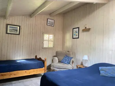 Un ou plusieurs lits dans un hébergement de l'établissement Chambre à la venelle