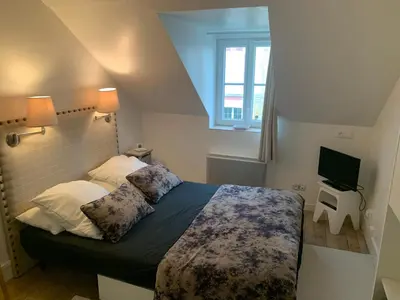 Un ou plusieurs lits dans un hébergement de l'établissement Appartement à 2 pas de la plage