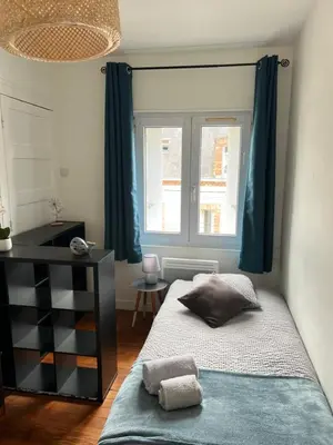 Un ou plusieurs lits dans un hébergement de l'établissement Appartement douillet