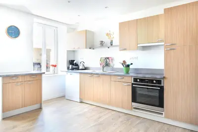 Cuisine ou kitchenette dans l'établissement Au Boulevard des Dunes - A 50m de la plage