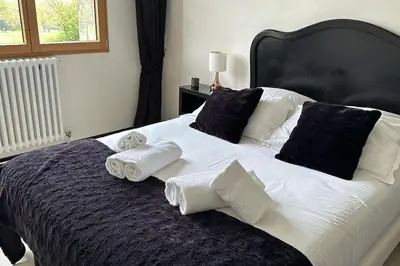 Un ou plusieurs lits dans un hébergement de l'établissement Location maison & gîte Normandie