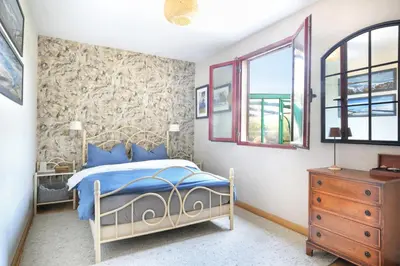 Un ou plusieurs lits dans un hébergement de l'établissement La Maison Merlin - Maison avec piscine Sénoville