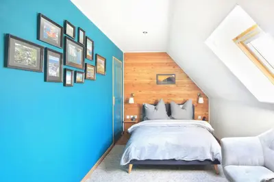 Un ou plusieurs lits dans un hébergement de l'établissement La Maison Merlin - Maison avec piscine Sénoville