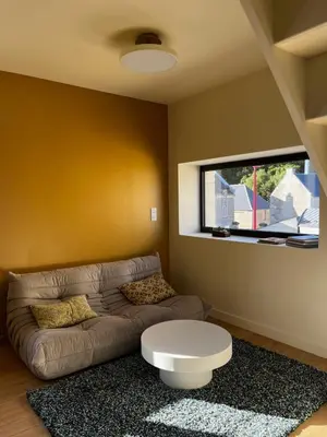 Télévision ou salle de divertissement dans l'établissement Maison de bord de mer