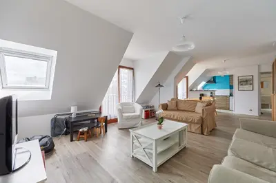 Coin salon dans l'établissement Le Repos de Cabourg - Appt à 650m de la plage