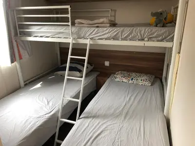 Un ou plusieurs lits dans un hébergement de l'établissement Mobil home