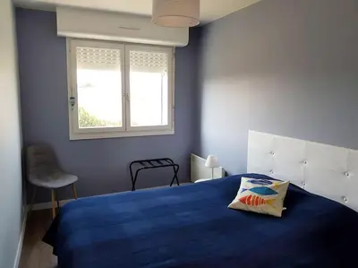 Un ou plusieurs lits dans un hébergement de l'établissement LE PATIO -PLAGE vue mer ,Normandie,Juno Beach