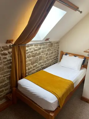Un ou plusieurs lits dans un hébergement de l'établissement Rustic and spacious converted Barn