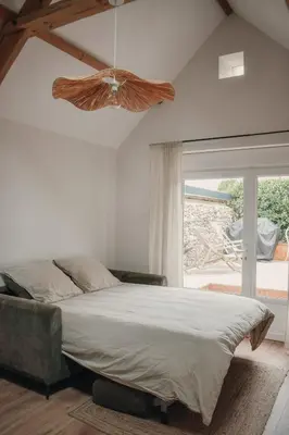 Un ou plusieurs lits dans un hébergement de l'établissement La Cabane - Gîtes des Havres