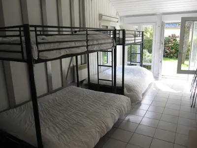 Un ou plusieurs lits dans un hébergement de l'établissement Maison avec grand jardin pour 15 couchages en Normandie