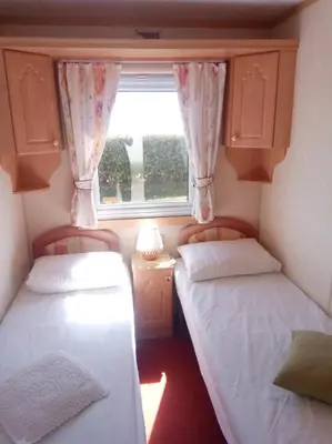 Un ou plusieurs lits dans un hébergement de l'établissement Mobil Home Front de mer