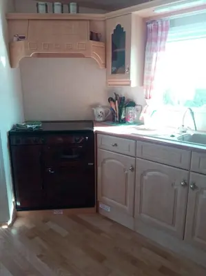 Cuisine ou kitchenette dans l'établissement Mobil Home Front de mer