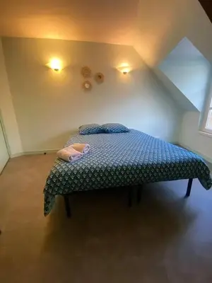 Un ou plusieurs lits dans un hébergement de l'établissement Studio charmant à Cherbourg-en-Cotentin - 20m² - Parking