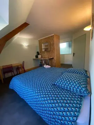 Un ou plusieurs lits dans un hébergement de l'établissement Studio charmant à Cherbourg-en-Cotentin - 20m² - Parking