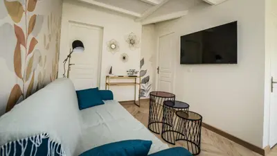 Télévision ou salle de divertissement dans l'établissement Maison calme éventail de Cabourg