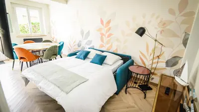 Un ou plusieurs lits dans un hébergement de l'établissement Maison calme éventail de Cabourg