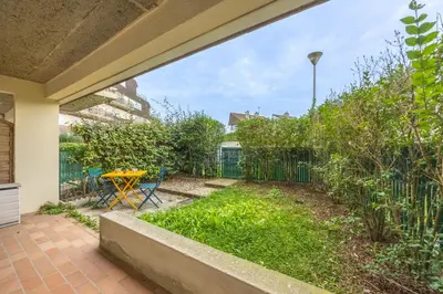Jardin de l'établissement Le Petit Cocon Marin - Appt à 200m de la plage