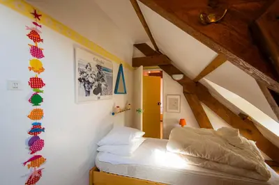 Un ou plusieurs lits dans un hébergement de l'établissement La Maison de la Mer - Vacation home in Normandy