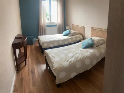 Un ou plusieurs lits dans un hébergement de l'établissement Bienvenue chez Virginie