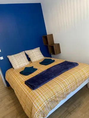 Un ou plusieurs lits dans un hébergement de l'établissement Maison Privé de bourg 4 personnes