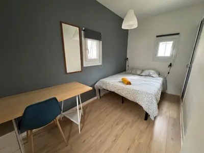 Un ou plusieurs lits dans un hébergement de l'établissement Appartement Caen théâtre