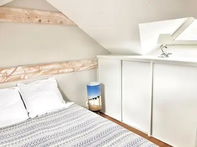 Un ou plusieurs lits dans un hébergement de l'établissement Maison bord de mer avec terrasse - Riva Bella