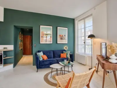 Coin salon dans l'établissement Superbe appartement rénové à Cabourg, face à la mer pour 2 - FR-1-788-33