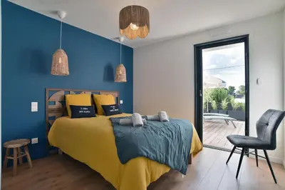 Un ou plusieurs lits dans un hébergement de l'établissement Cancale à la plage - Maison avec terrasse pour 6