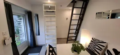 Télévision ou salle de divertissement dans l'établissement Les gîtes de La Petite Taupe - Akotee