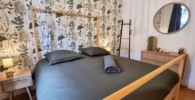 Un ou plusieurs lits dans un hébergement de l'établissement La maison GUILLAUME