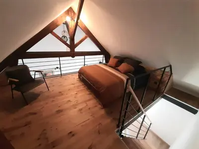 Un ou plusieurs lits dans un hébergement de l'établissement Loft proche Bayeux