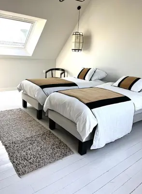 Un ou plusieurs lits dans un hébergement de l'établissement Maison familiale cosy proche mer Agon Coutainville