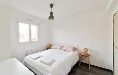 Un ou plusieurs lits dans un hébergement de l'établissement Maison Flair