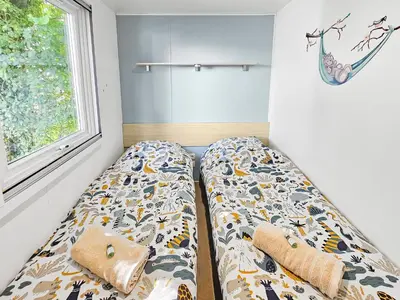 Un ou plusieurs lits dans un hébergement de l'établissement Mobile Home Eden